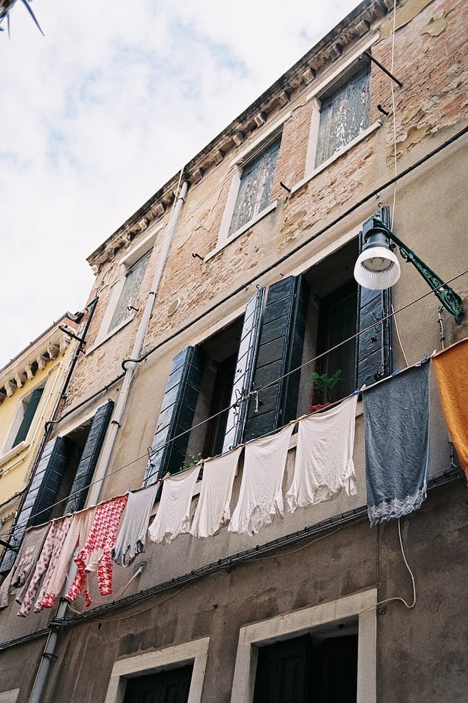 low angle view of a building with laundry. Italy. Italy Travel Specialist, Italy Travel Advisor